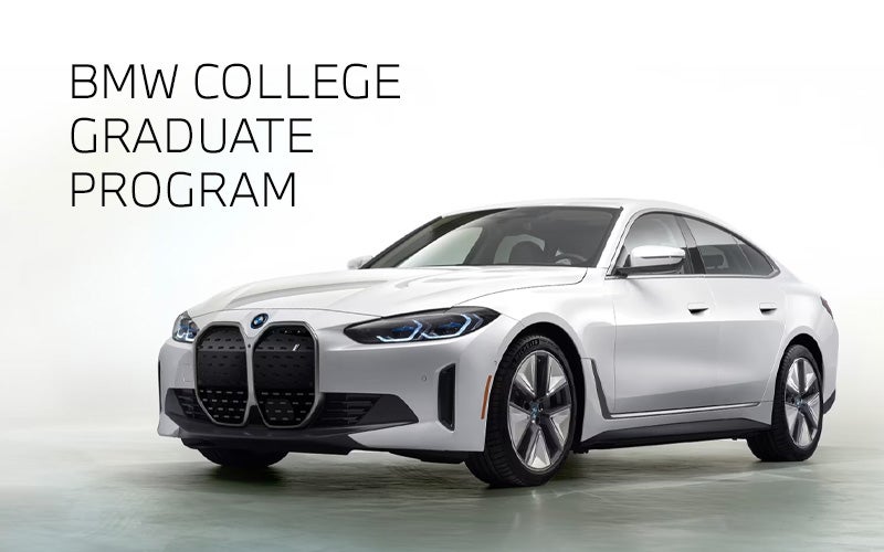 White BMW i4 parked. BMW College Graduate Program. | BMW of Charlottesville in Charlottesville VA